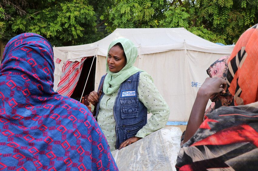 Plan International staff member Nahid Ali with displaced women in Kassala State, Sudan.